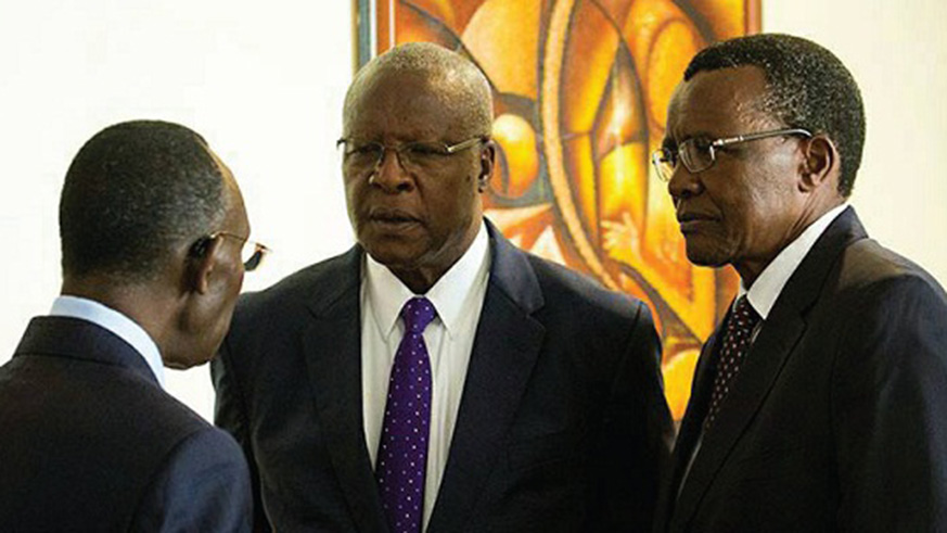 Rwandau2019s Chief, Justice Sam Rugege (left) chats with Bart Katureebe, the Chief Justice of Uganda (C), and David Maraga, Kenyau2019s Chief Justice (R), at the East African Magistrates and Judges Conference in Kigali in November, last year. Courtesy.