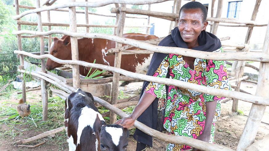 One of the beneficiaries of Heifer and a house.