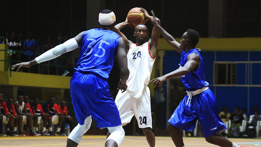 REG skipper Ali Kubwimana (middle) in a past league game againt Espoir. Sam Ngendahimana