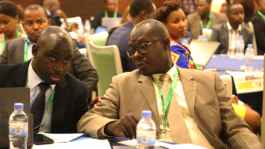 Participants consult with each other during the workshop yesterday (Sam Ngendahimana)