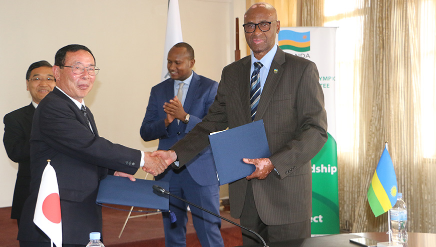 The Mayor of Hachimantai City of Japan, Mr. Masahiko Tamura (left) and RNOSC President Amb Valens Munyabagisha (right) during the MoU signing on Tuesday at the Ministry of Sports and Culture. (Jejje Muhinde) 