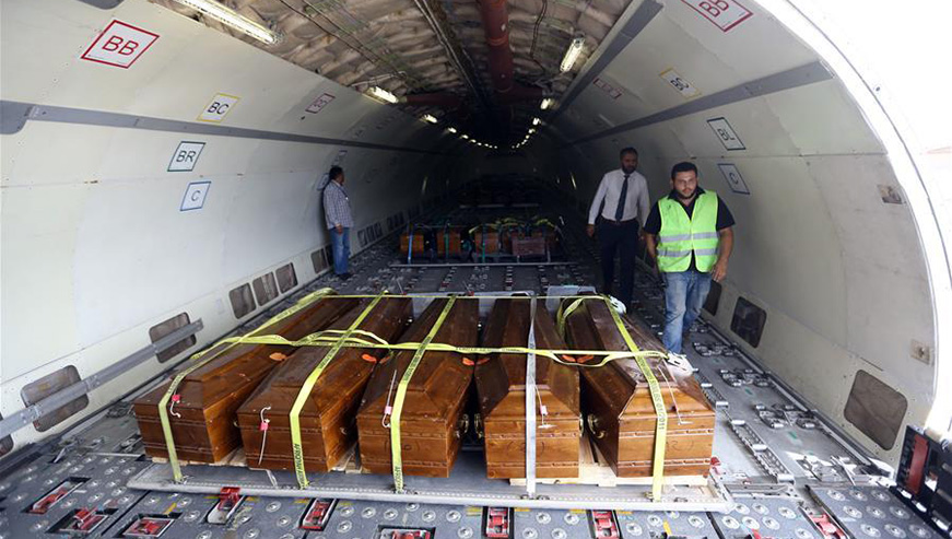 The remains of 20 Egyptian Christians, who were executed in 2015 by the Islamic State (IS) militant group in Libya, are seen on a plane in Libya's Misurata International Airport. (Net photo)