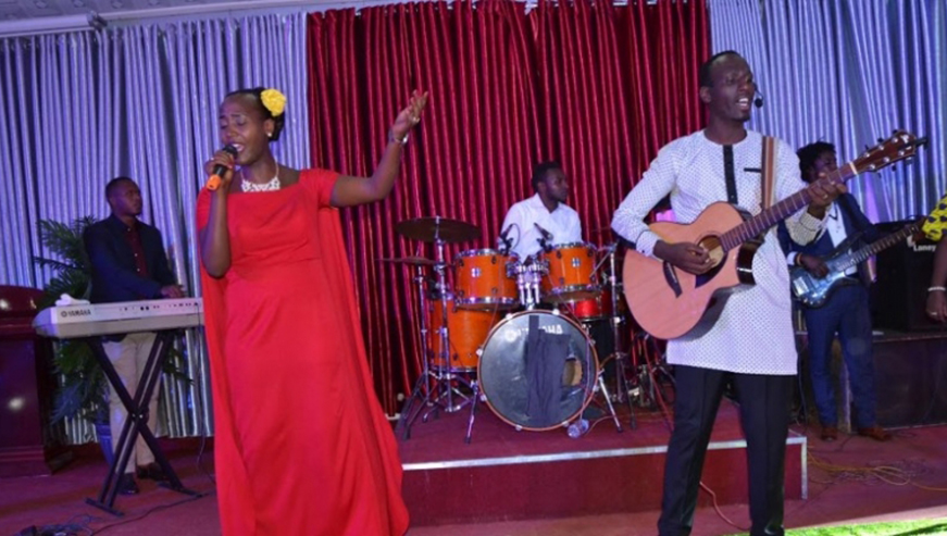 Husband and wife duo Serugo and Mbanza are set to launch their first album this month. The couple is pictured performing at a past gospel concert in Kigali. /Courtesy.  