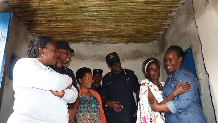 The joyful beneficiary of solar energy in Kamonyi District hugging Minister of Health, Dr. Diane Gashumba
