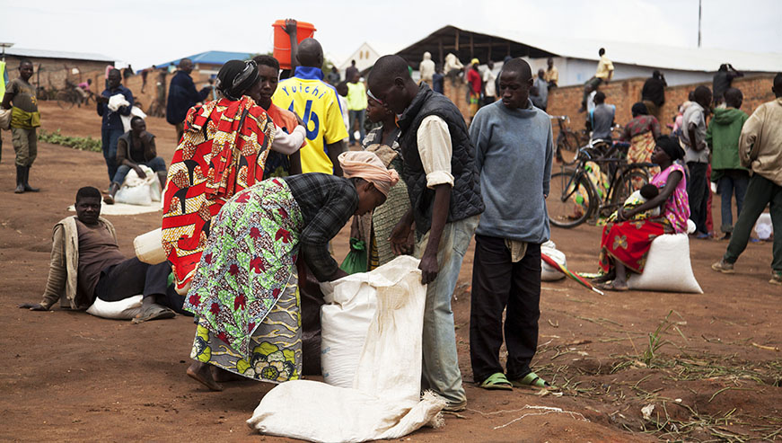 Burundian refugees receive food rations at Mahama refugee camp. Sam Ngendahimana.