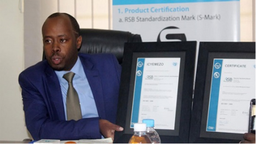 RSB Director General displays the accreditation certificate.