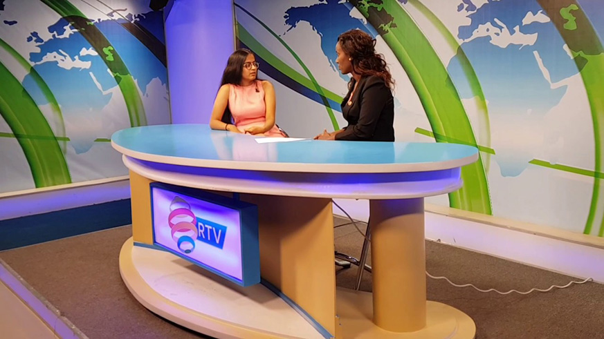 Rwanda Televisionâ€™s Theopista Umutesi (R) hosts a guest on RBA. Courtesy.