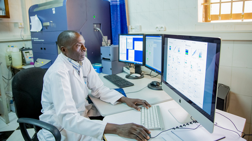 A lab scientist analyzing data at the facility.