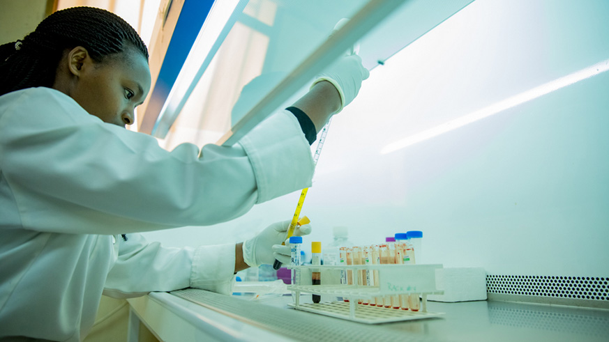 A lab scientist carries out tests on blood samples at PSF.