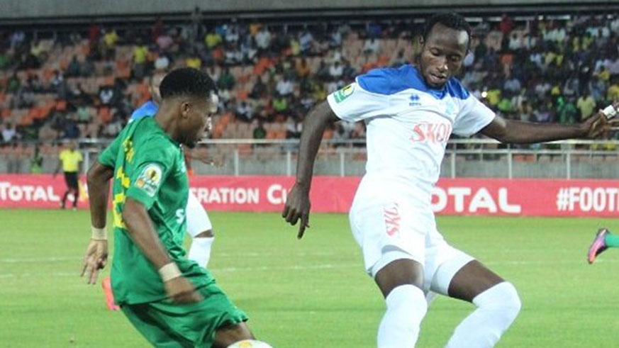 Rayon Sports centre-back Thierry Manzi (right) challenges for the ball against a Young Africansu2019 player on Wednesday at Uwanja wa Taifa in Dar es Salaam. Courtsey.