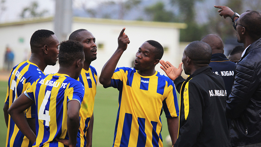 AS Kigali players and coach Eric Nshimiyimana (far right) at a past match. Sam Ngendahimana.
