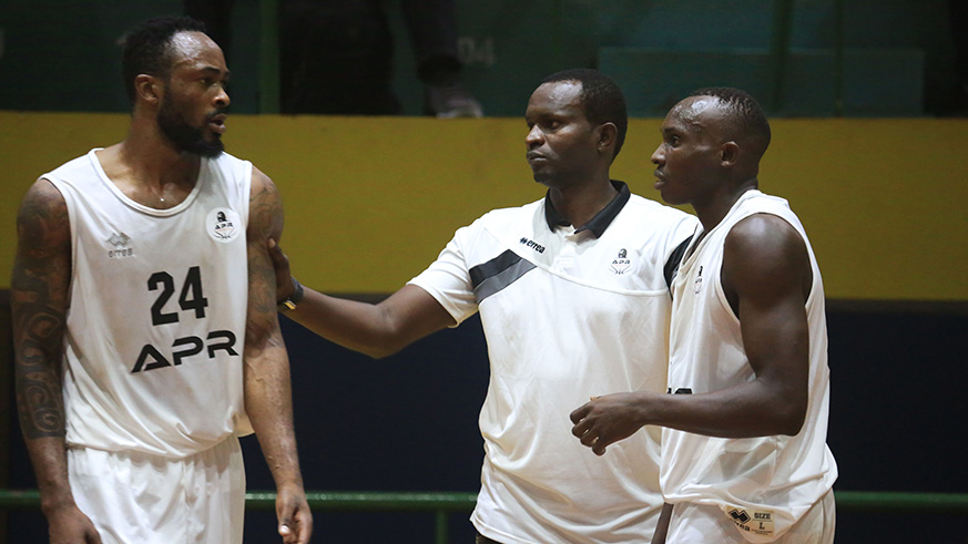 Head coach Aime Karim Nkusi (middle) hopes to end APRu2019s 7-year title drought.  Sam Ngendahimana.