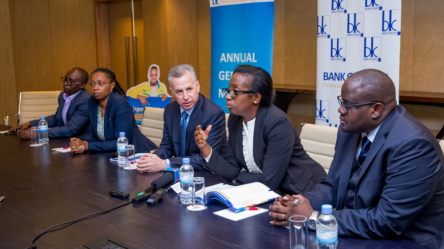 Bank of Kigali chief executive Diane Karusisi speaks during the annual general meeting as BK Group PLC board members (L-R) Reuben Karemera, Liliane Igihozo, Marc Holtzman (Chairman) and Julien Kavaruganda look on at Marriott Hotel in Kigali yesterday.