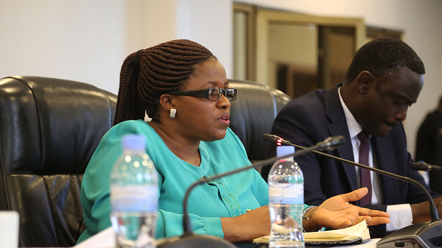 Minister Jeanne du2019Arc De Bonheur appears before the parliamentary Standing Committee on National Budget and Patrimony on Thursday. On her right is Olivier Kayumba Rugina, Permanent Secretary in the Ministry of Disaster Management and Refugee Affairs. Sam Ngendahimana.