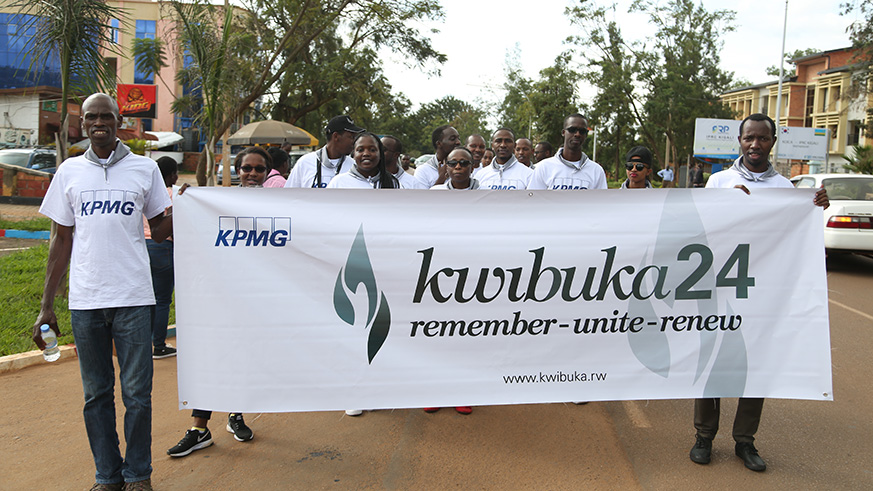 KPMG staff observe a minute of silence in honour of the victims of the 1994 Genocide against the Tutsi before laying wreaths at Nyanza Genocide Memorial.
