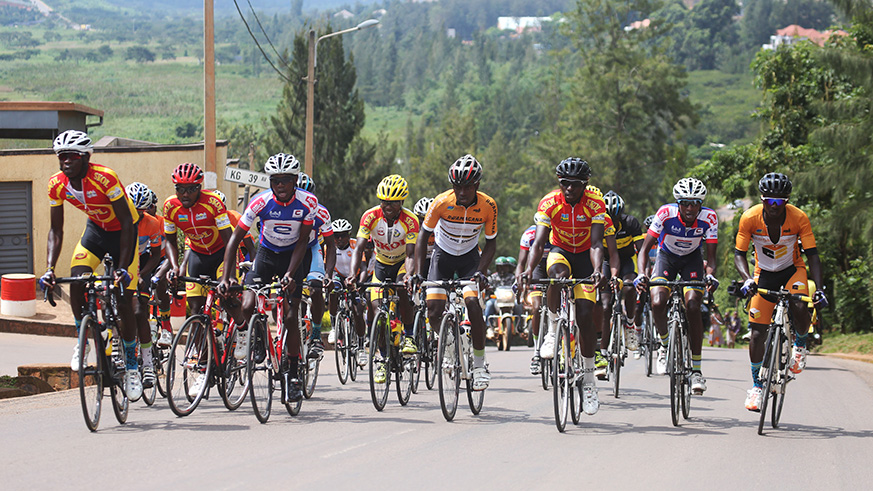 Riders in the peloton climb the most challenging climb of the race at Kigali Parents School in Kigali