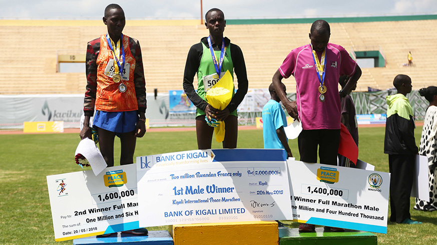 Winners in Full Marathon  pose with their cheques
