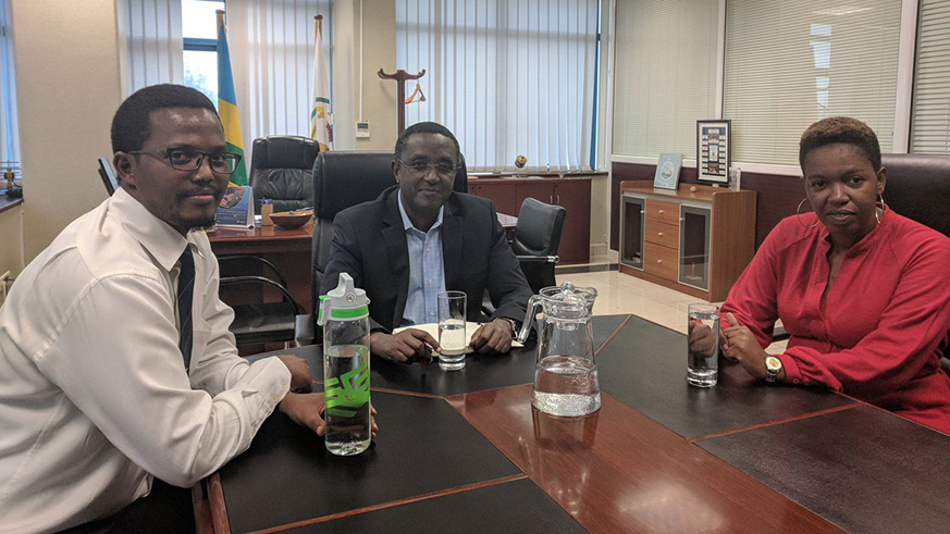 Minister Vincent Biruta and other ministry officials pose for a photo in their office. (Courtesy)