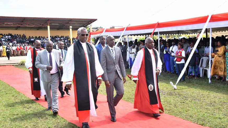 Dr. Laurent Mbanda(L), Minister Kaboneka and Archbishop of Anglican Church in Rwanda Onesphore Rwaje during the enthronement ceremony of Bishop Samuel Mugiraneza. Regis Umurengezi
