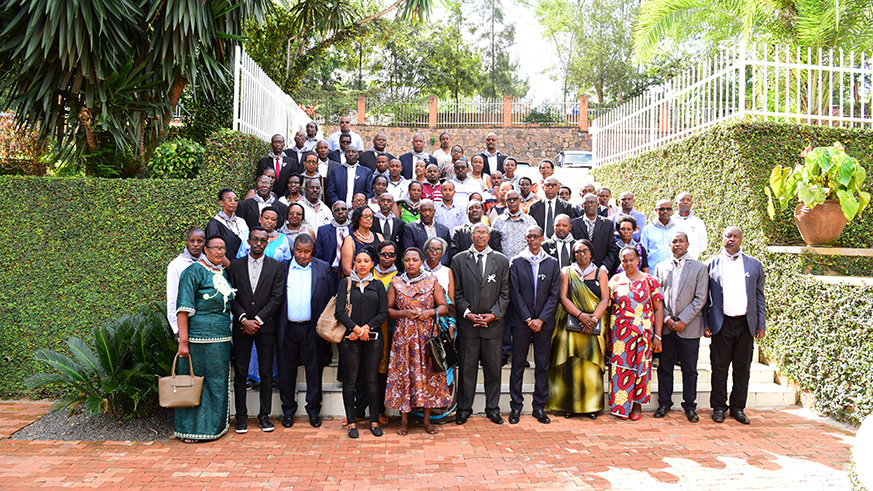 Former Lubumbashi studentsâ€™ Association pose for a group photo with the families of victims at Kigali Genocide Memorial. (Frederic Byumvuhore)