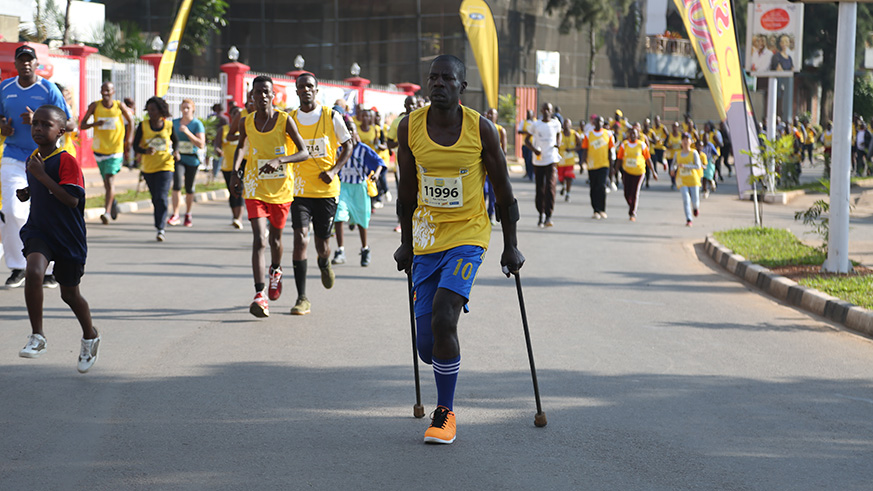 Team Rwanda's star Jean Marie Vianney Myasiro(c) with other athletes at Kisimenti in Kigali