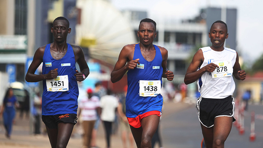 Team Rwanda's star Jean Marie Vianney Myasiro(c) with other athletes at Kisimenti in Kigali