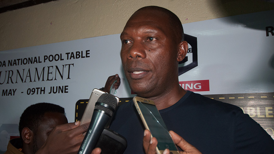 Vianney Kayiranga talking to members of the press after winning Rubavu preliminaries of the Pool Table Championship. (Peter Kamasa)