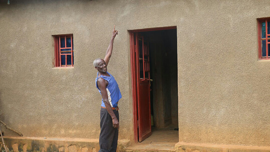 Hagiriryayo points to one of his solar powered security lights. Courtesy.