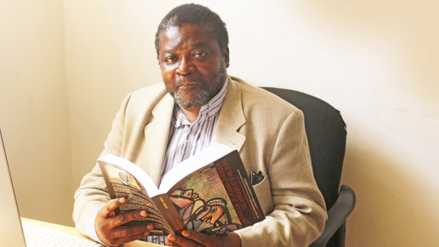 Thierry Sinda with a copy of his book. Courtesy.