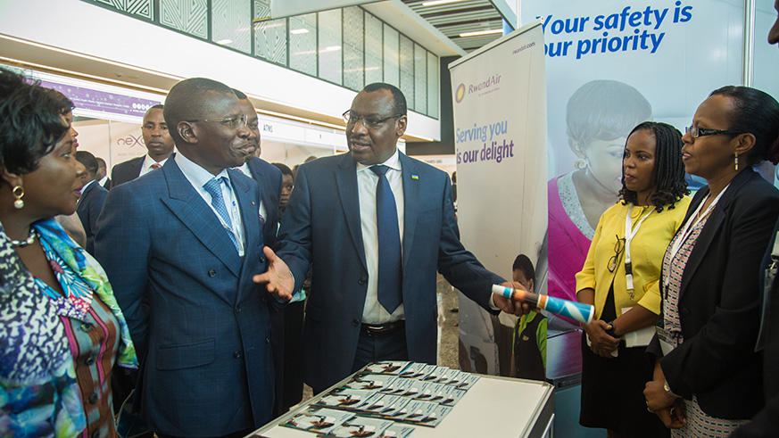 L-R: Ghanaian Minister for Aviation, Cecilia Abena Dapaah; Togoâ€™s Minister for Infrastructure and Transport, Ninsao Gnofam; and Rwandaâ€™s Minister for Infrastructure, Claver Gatete, visit the RwandAir booth at the ongoing Africa Aviation Safety Management Symposium at Kigali Convention Centre yesterday. NadegeImbabazi.