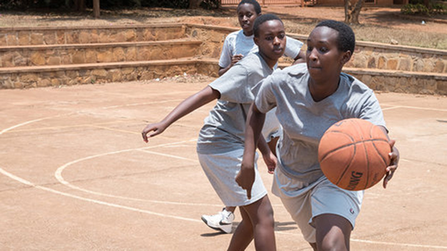 Girls play basketball after class. Co-curricular activities can give the brain a boost. Net. 