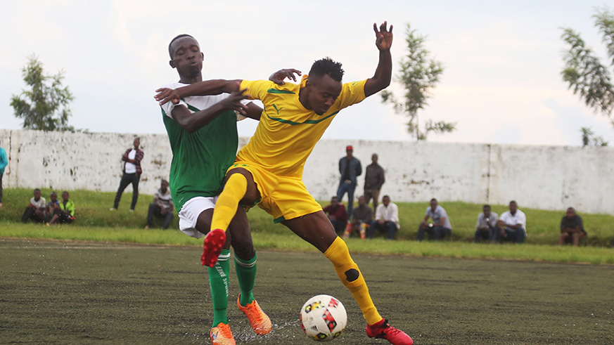 Djuma Nizeyimana battles for the ball with AS Kigali midfielder during the match