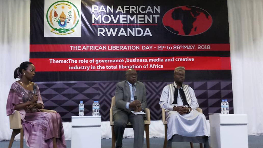 Anglican Bishop John Rucyahana (C) and Sheikh Daudi Bishokaninkindi (R) speak at the event in Kigali. (Courtesy)