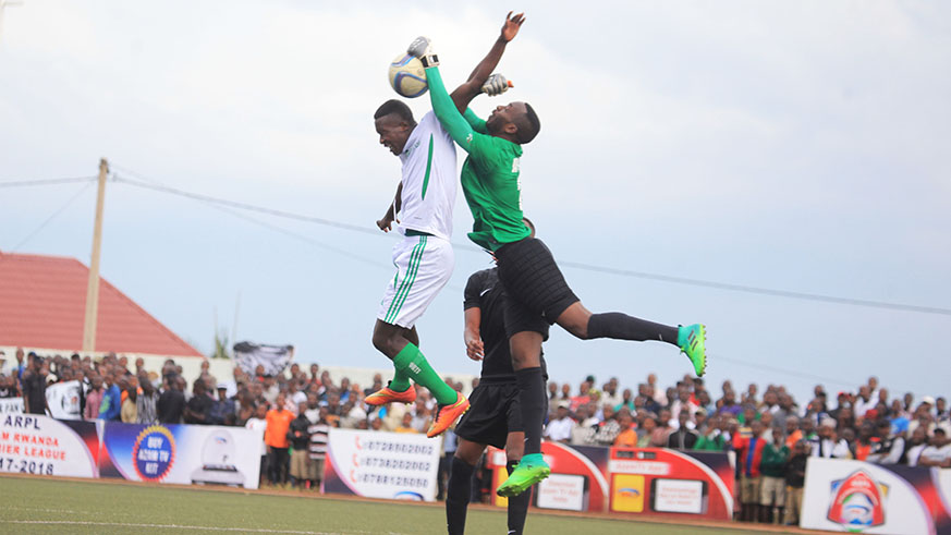 Army Side goalkeeper Yves Kimenyi battles for the ball during the league match against Kiyovu at Mumena. Sam Ngendahimana.