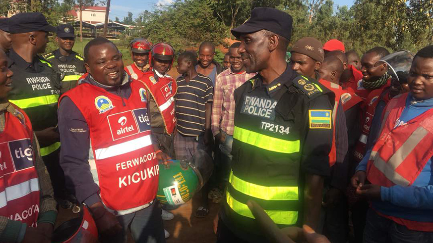 A police officer speaking to cyclists on road safety