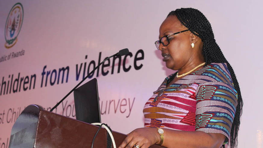 Dr. Yvonne Kayiteshonga, the head of mental health at the Rwanda Biomedical Center, giving her remarks at the launch of the report on violence against children and youth. Diane Mushimiyimana.