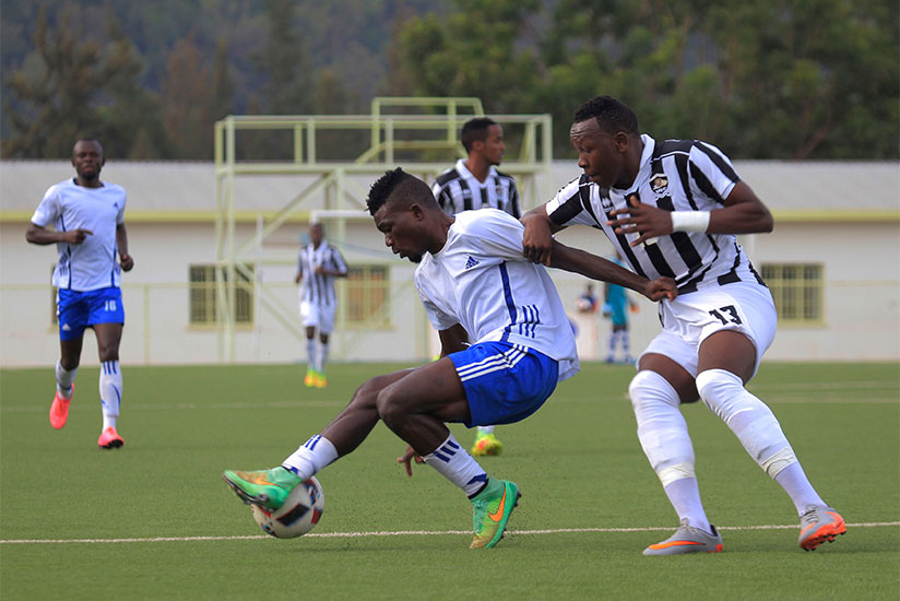 Bottom side Pepiniere's Michel Nduwimana controls the ball against APR's left defender Aimable Nsabimana at Kigali Stadium in a past match. File.