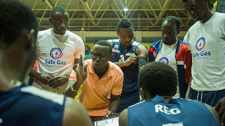 REG head coach Patrick Ngwijuruvugo is seen here giving instructions to his players in a time-break during the third quarter. (Nadege Imbabazi)
