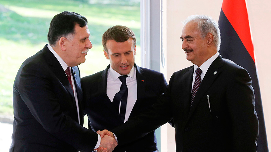 Macron (centre) with Fayez al-Sarraj and Gen Khalifa Haftar last summer. / Internet photo