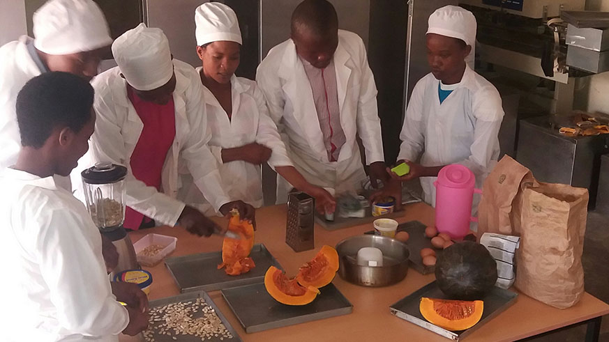 Some of the companyâ€™s employees are cutting pumpkins to make products like cakes at their company premises in Muhanga. All photos/Courtesy.