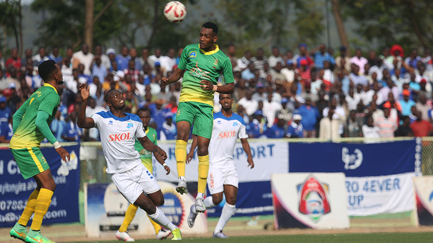Ally Niyonzima in the air for a header yesterday at Kigali Stadium. / Sam Ngendahimana