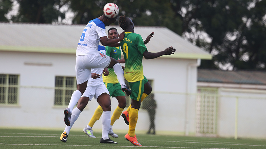 AS Kigali's Frank Kalanda vies for the ball against Rayon Sports' Yannick Mukunzi. / Sam Ngendahimana