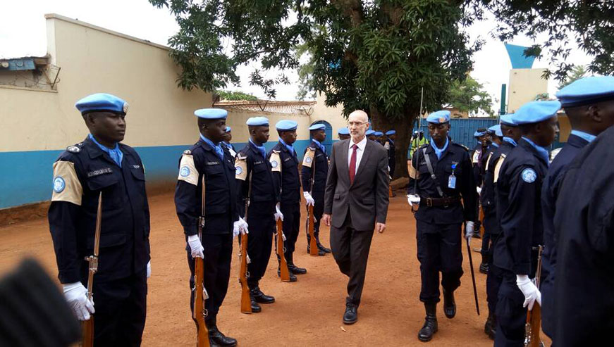 Deputy Representative of the UN-Secretary General in MUNUSCA, Kenneth Gruck inspecting a guard of honor mounted by the decorated officers.