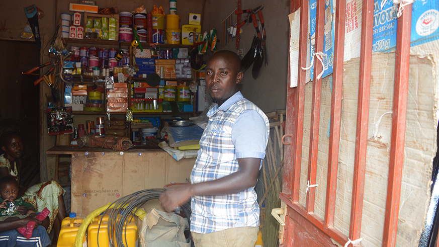 Theogene Gatarayira in his hardware shop.