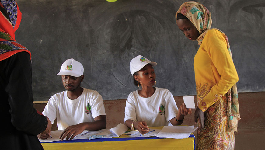 Volunteers help voters at Groupe Scolaire Camp Kigali in Nyarugenge District during the presidential elections held in August last year. The National Electoral Commission says at least seven million voters will take part in the September parliamentary polls. Sam Ngendahimana.