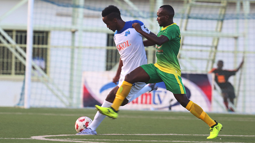Rayon Sports midfielder Yannick Mukunzi battles for the ball with AS Kigali's Rodrigue Murengezi during the match. / Sam Ngendahimana