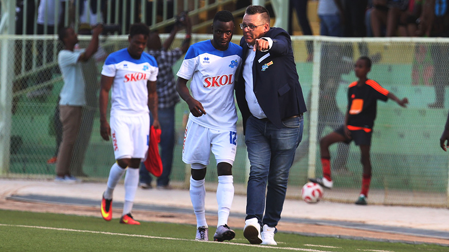 Rayon Sports goal scorer Gilbert Mugisha listens to his coach Ivan Minnaertu2019s instructions during yesterdayu2019s match against AS Kigali at Kigali Stadium. / Sam Ngendahimana