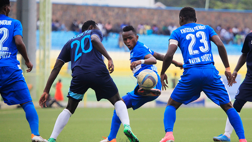 Rayon Sportu2019s duo of Kevin Muhire and Pierrot Kwizera in action against Police FC during a past match at Kigali Stadium. Sam Ngendahimana.