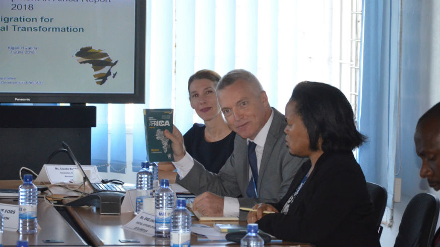 Claudia Roethlisberger, co-author of the new UNCTAD report; Andrew Mold, the Acting Director of the ECA Subregional Office in Eastern Africa; and Emelang Leteane, ECA Social Affairs Officer, at the reportâ€™s launch in Kigali on Friday.