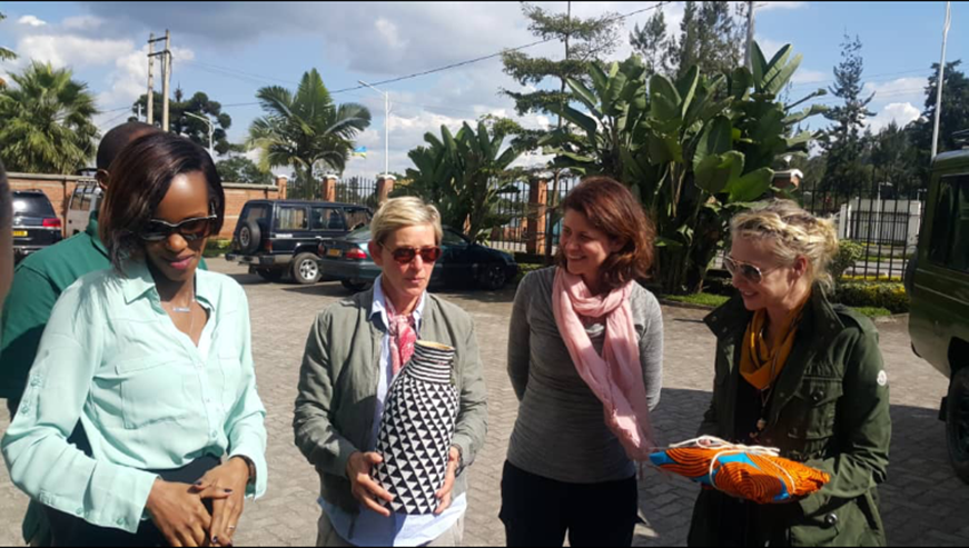 Ellen DeGeneres (centre) and her partner Portia de Rossi (extreme right) receive gifts from Haute Baso, one of the top fashion boutiques in Rwanda, that was presented to them by RBDâ€™s Kaliza Belise (left). Courtesy. 